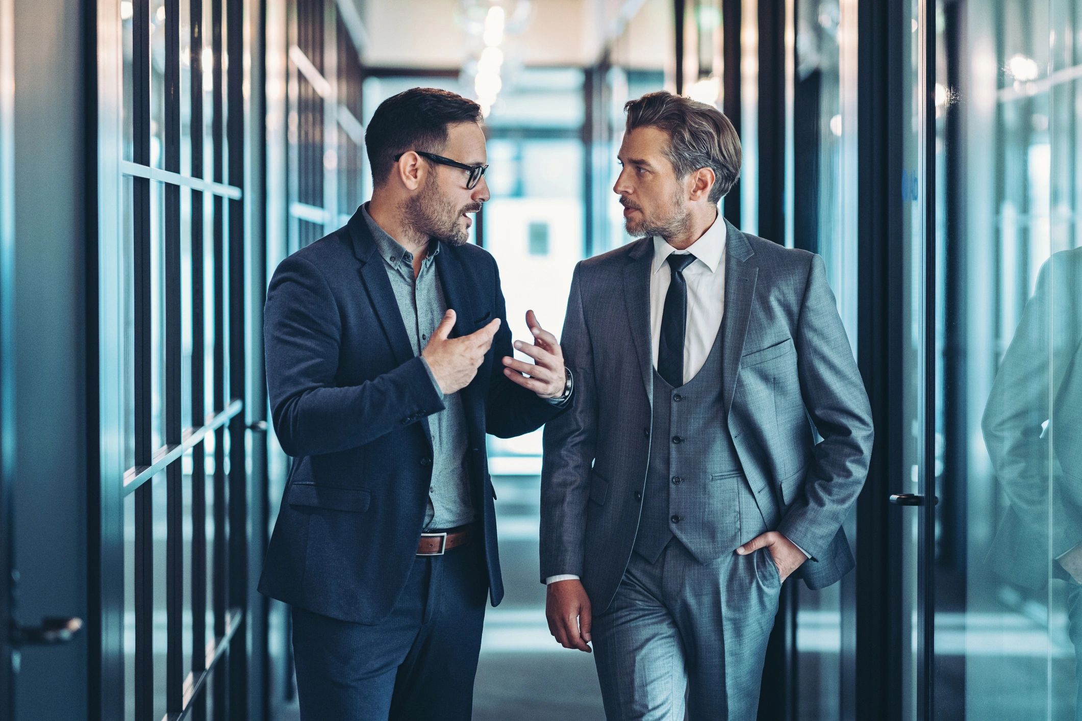 Professionals discussing a matter while walking