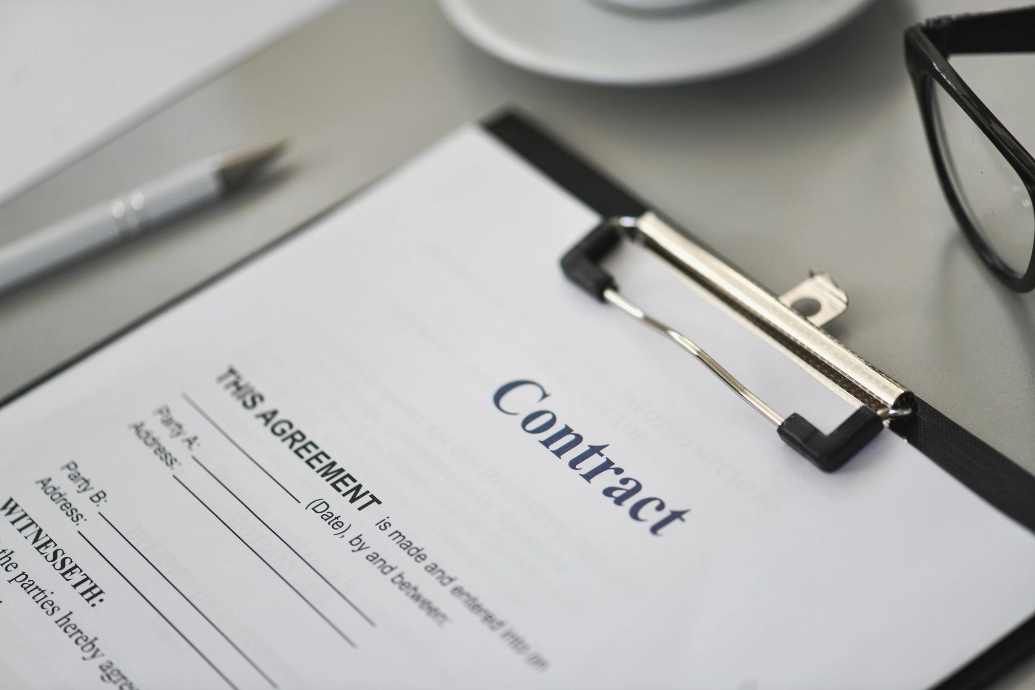 Close-up of legal documents and contract review materials on a desk